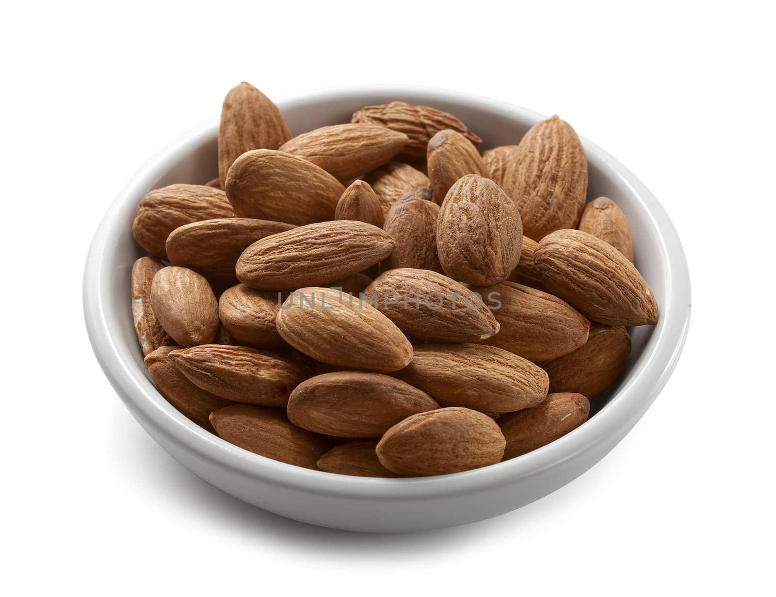 Handful of almonds on the white plate