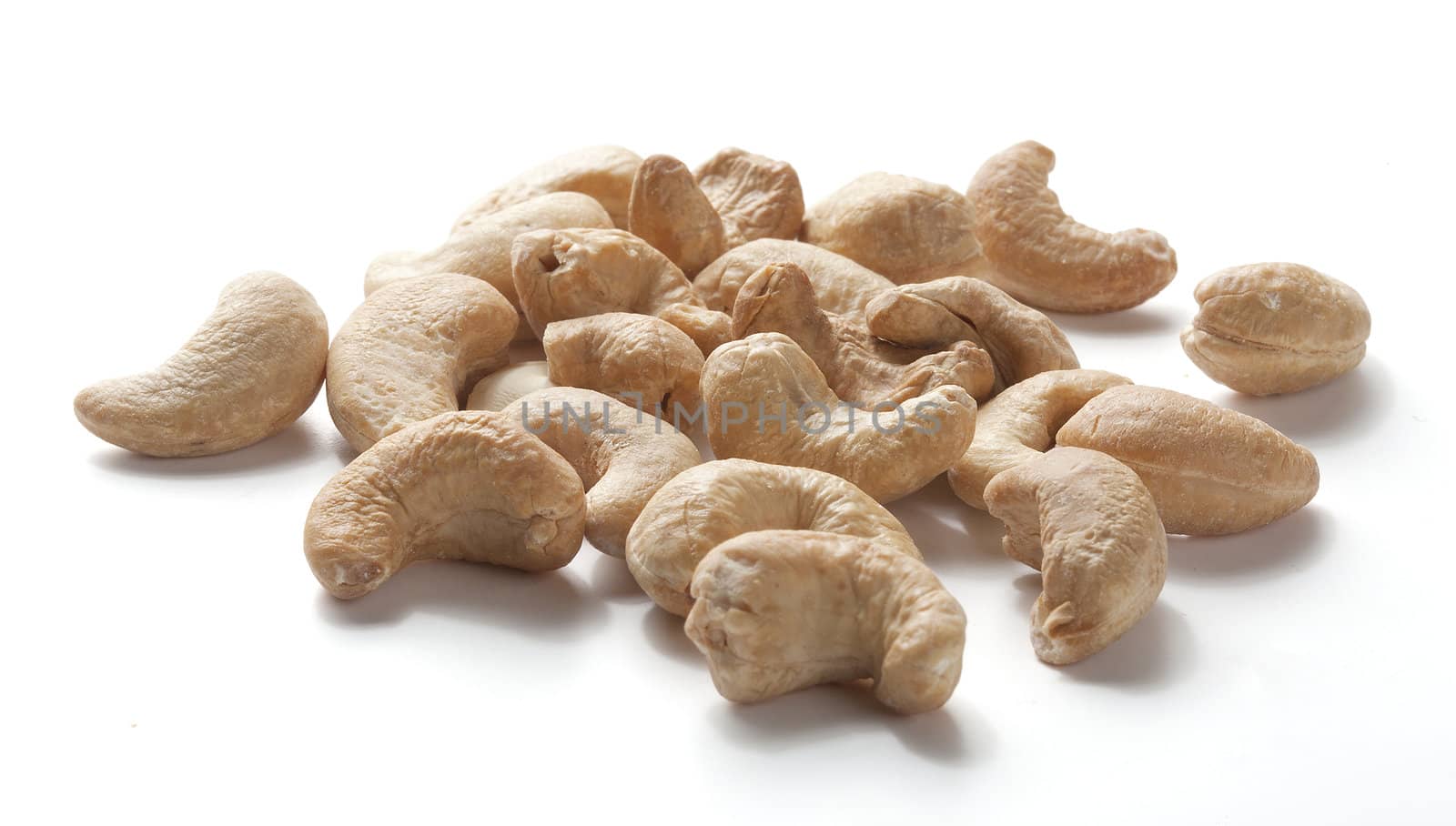 Isolated handful of cashew nut on the white background