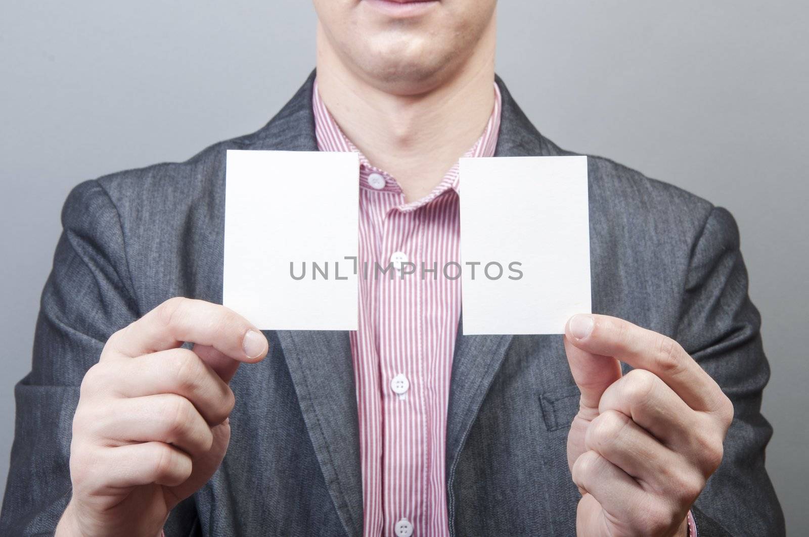 An image of businessmen holding blank card