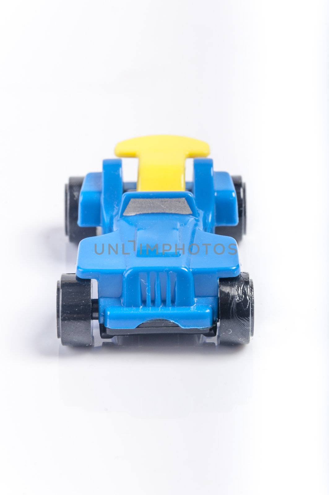 An image of blue toy car isolated on white background