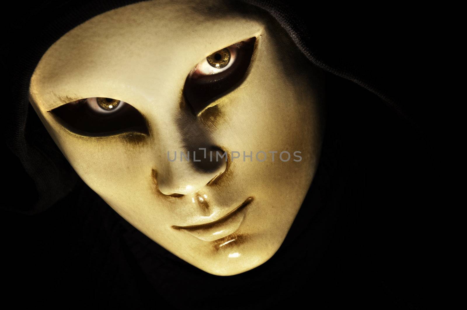 a carnival mask on a black background