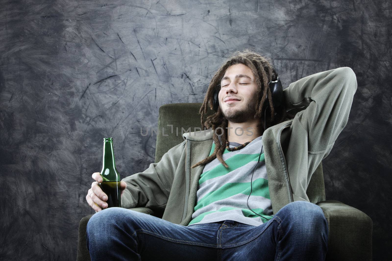 relaxed young man enjoying music 