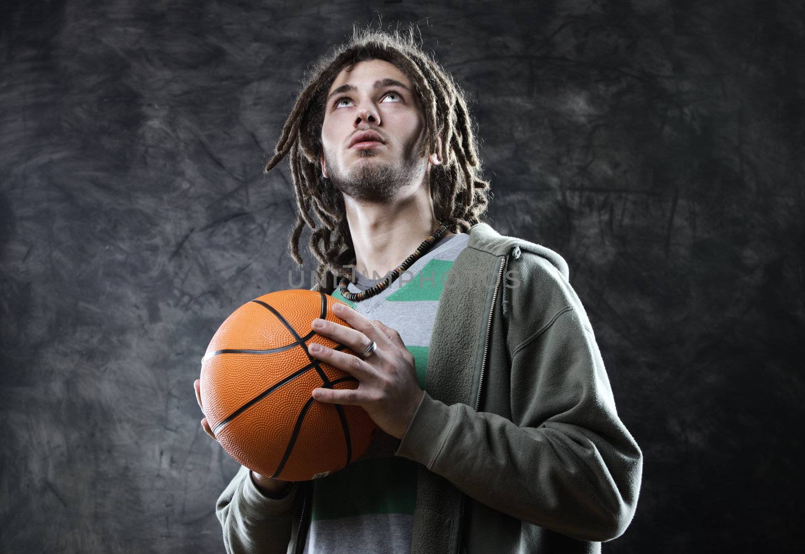 Basketball player taking the shot with a basketball