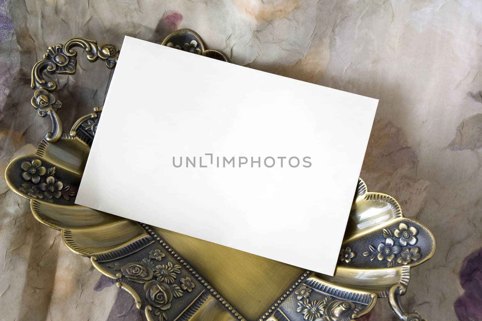 blank white card on golden tray