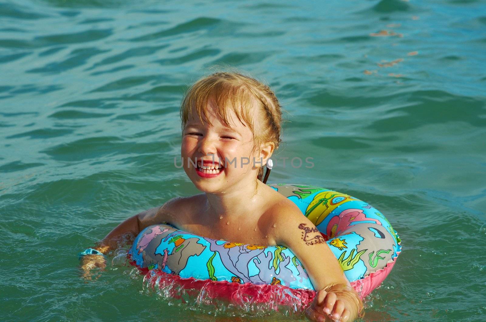 ittle girl on the beach.Mediterranean Resort Antalya Turkey