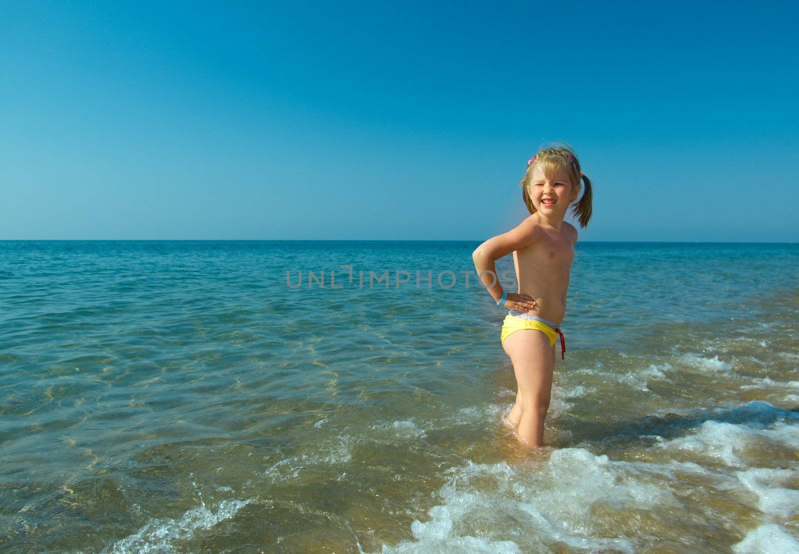 ittle girl on the beach.Mediterranean Resort Antalya Turkey