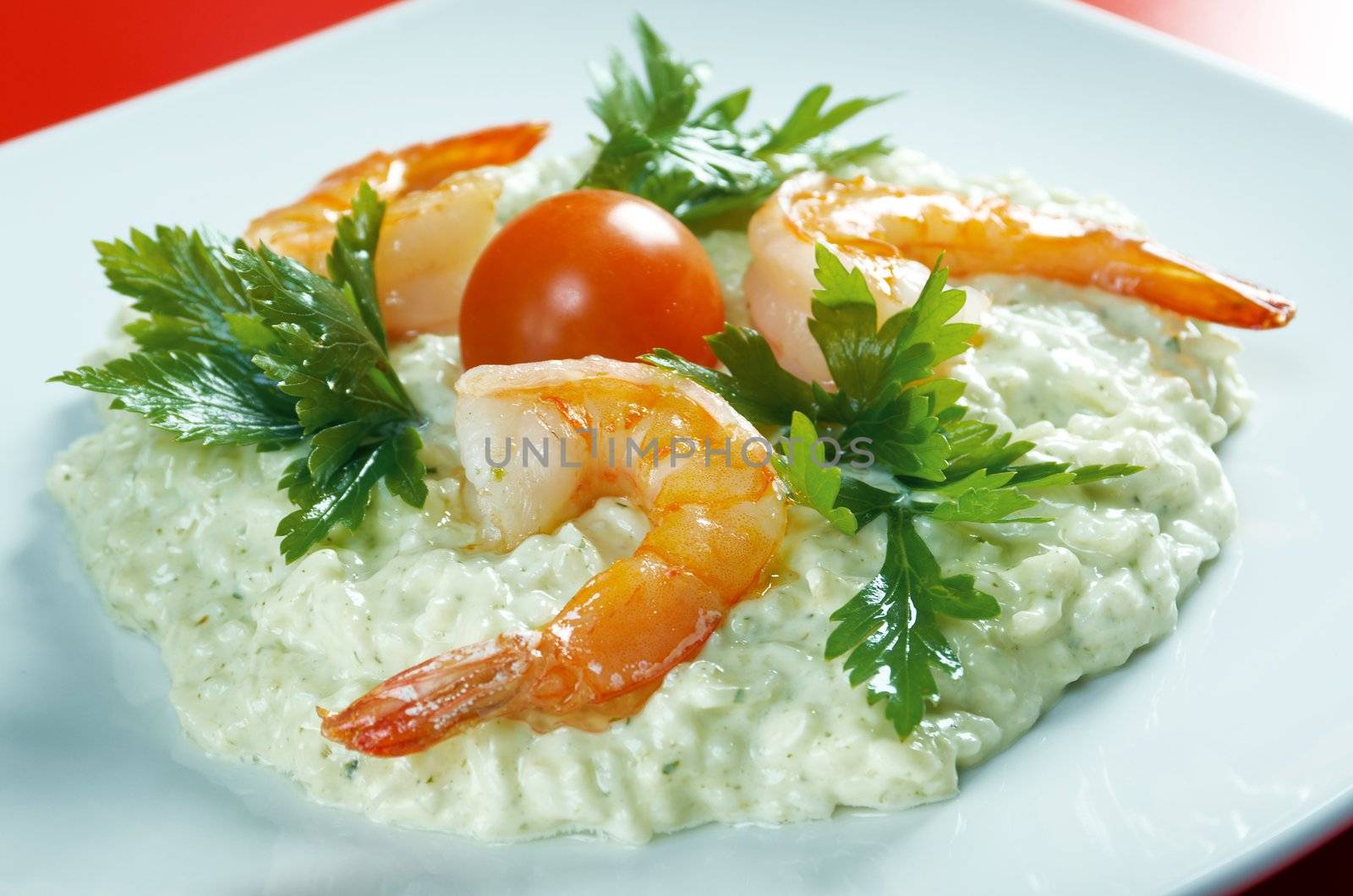 Delicious italian risotto with shrimps. Close-up