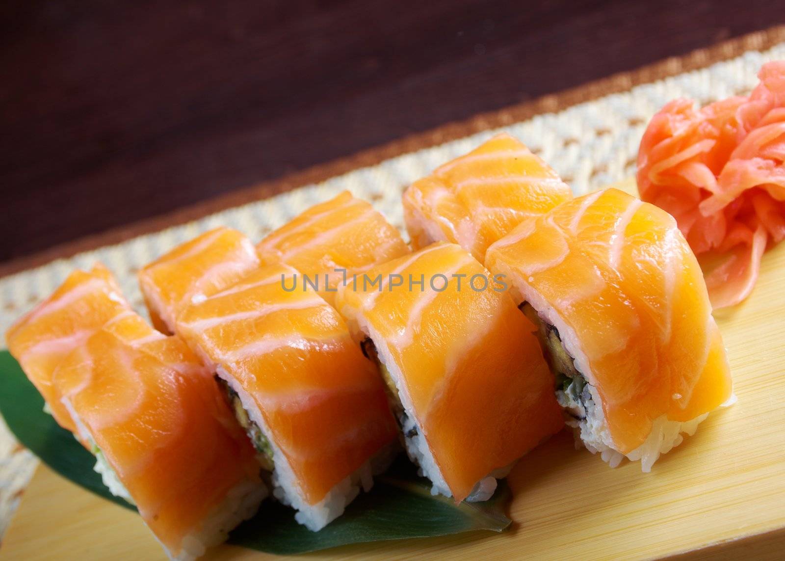 Uramaki. Philadelphia classic. Salmon, Philadelphia cheese, cucumber, avocado, tobiko. Japanese sushi