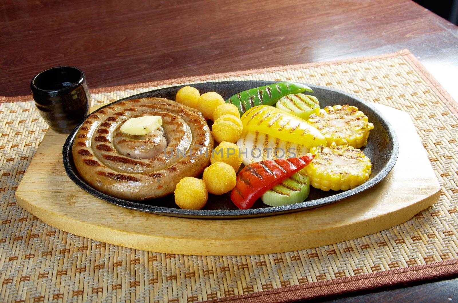 Japanese cuisine .Sausage making roasted with vegetable