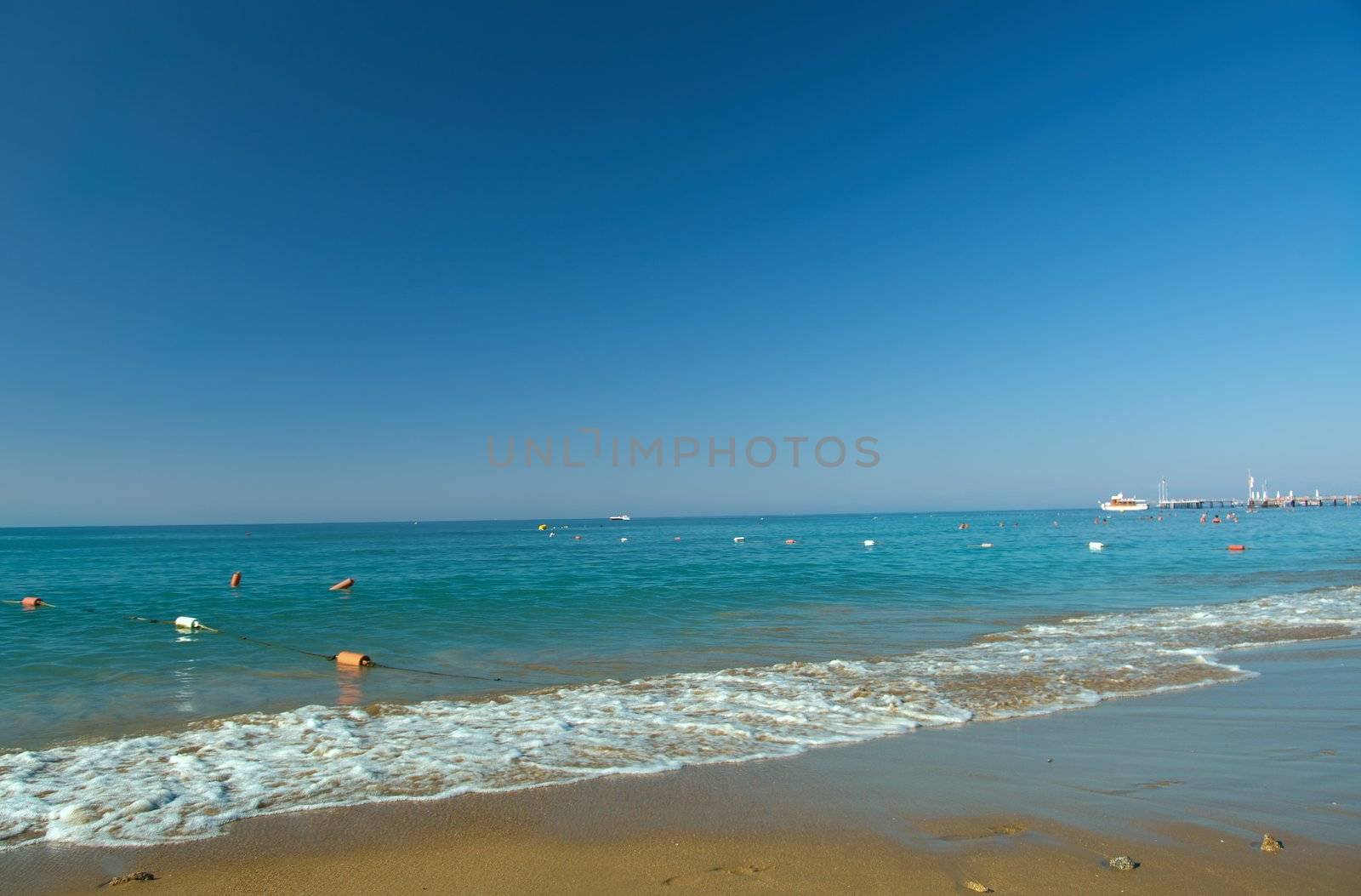 Beach with waves at the Mediterranean Resort Antalya Turkey