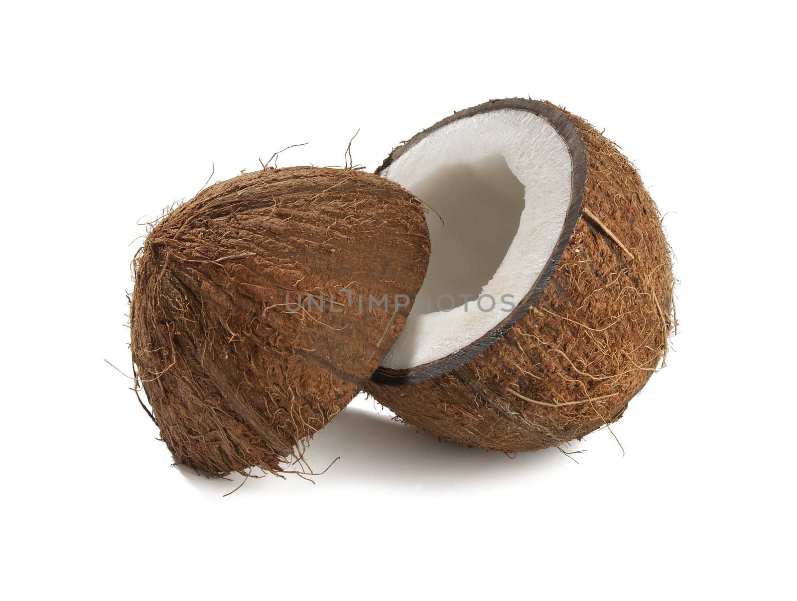 One opened coconut on the white bakground