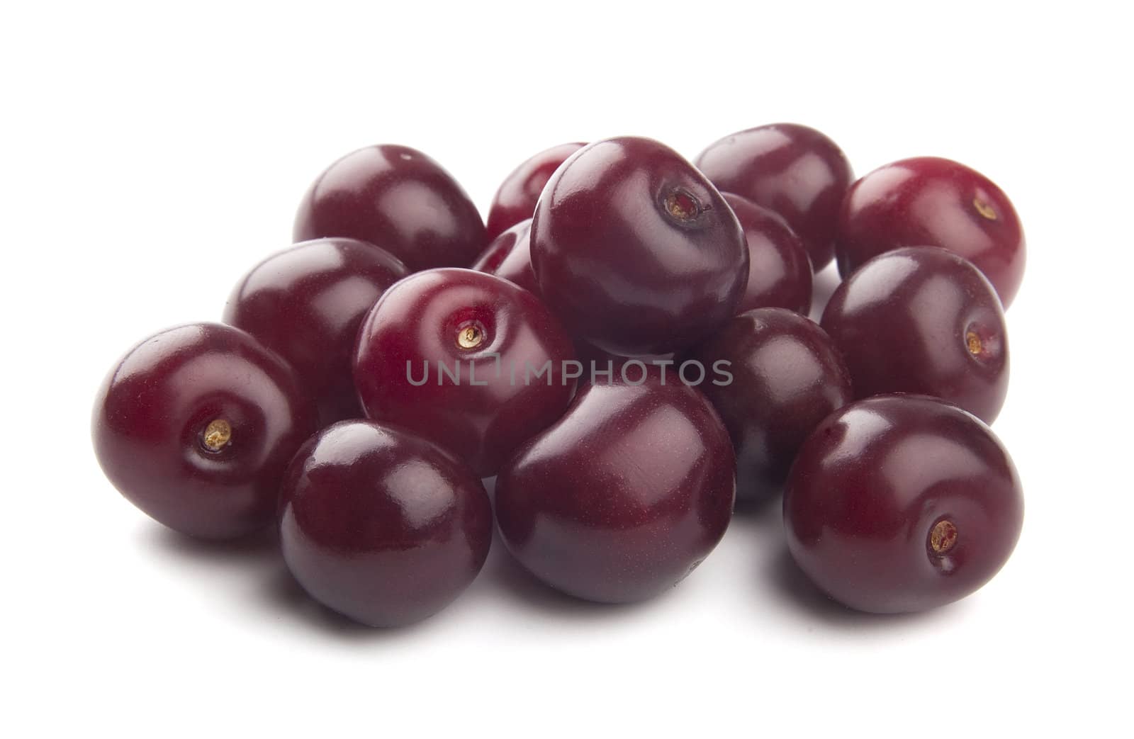 Handful of red cherries on the white