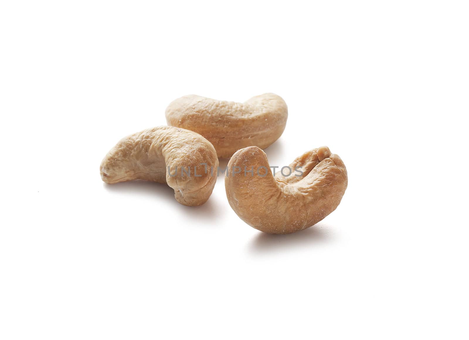 Three isolated cashew nut on the white background