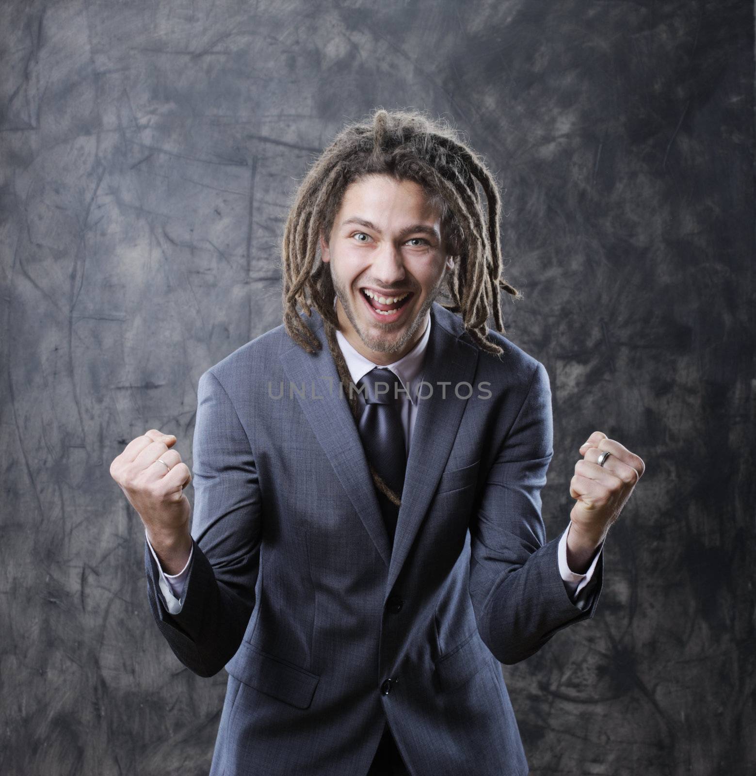 Happy business man celebrates success