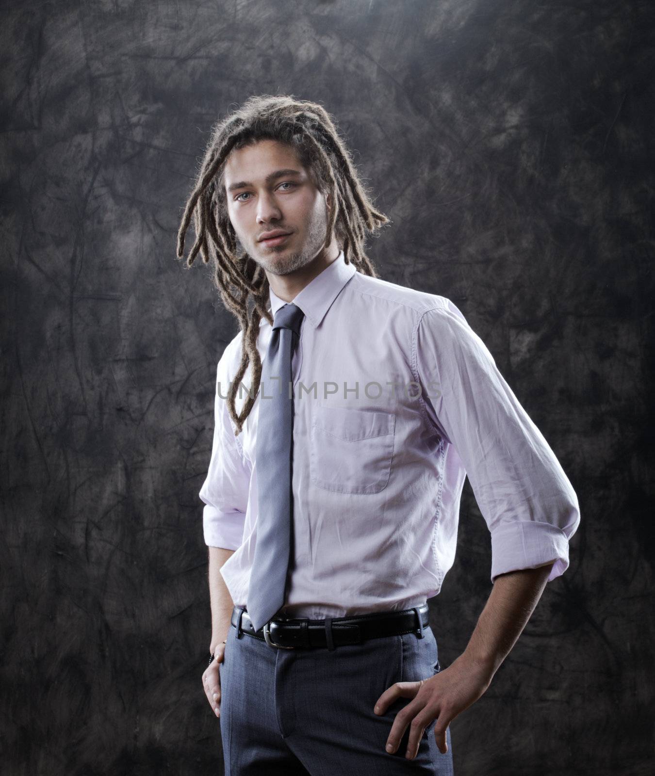 Portrait of positive well-dressed businessman