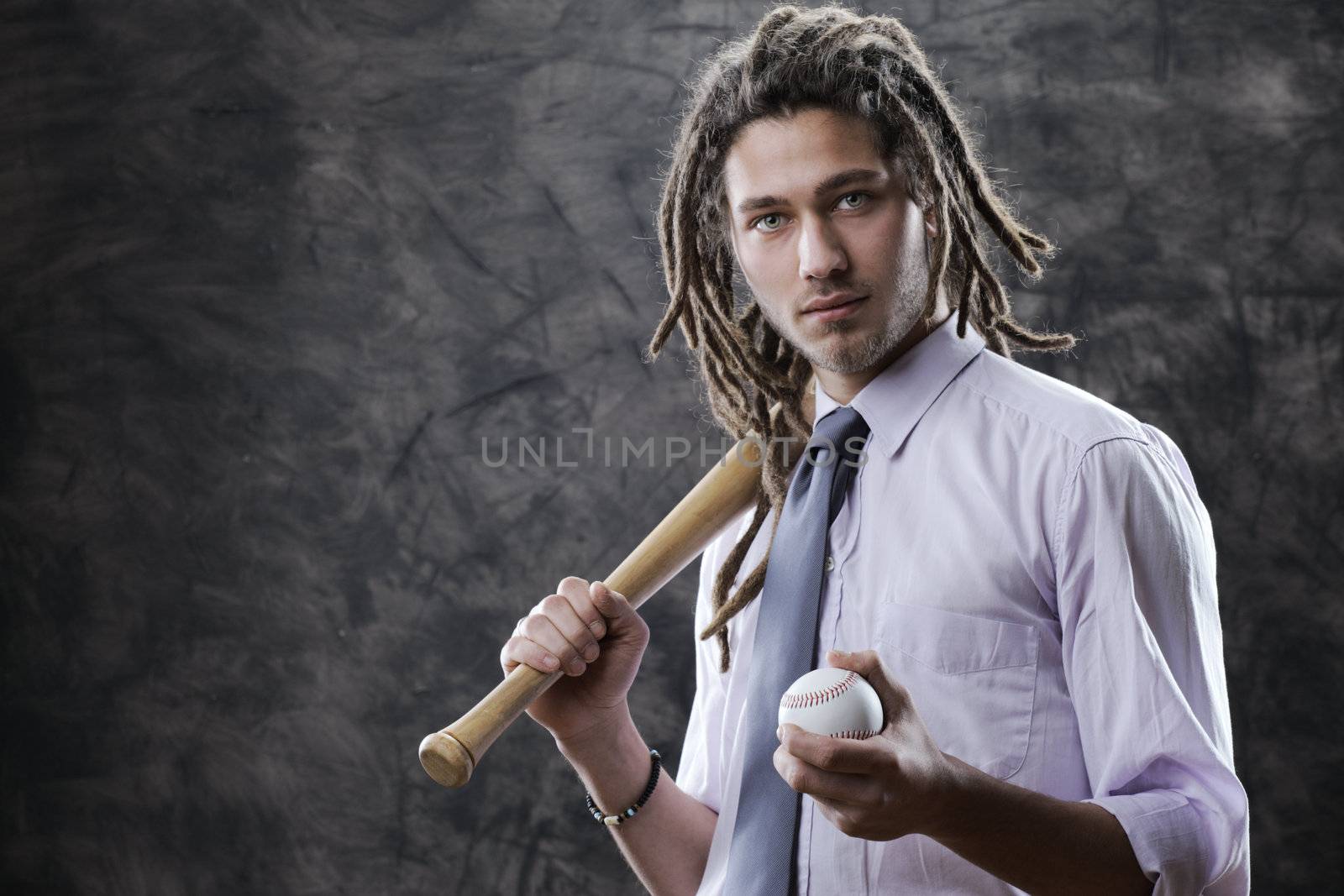 Portrait of young businessman with baseball bat