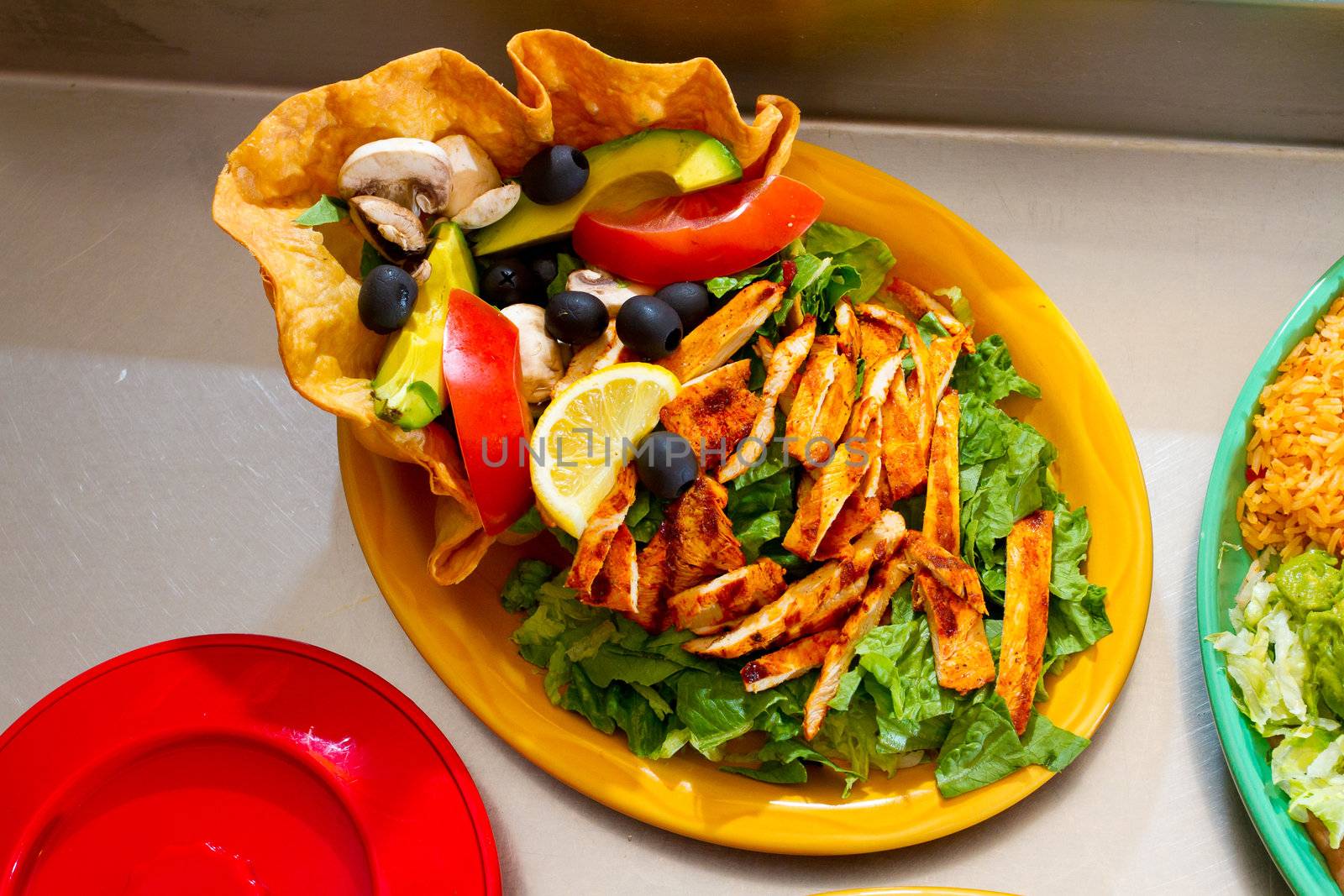 A salad at a Mexican restaurant ready to be served.