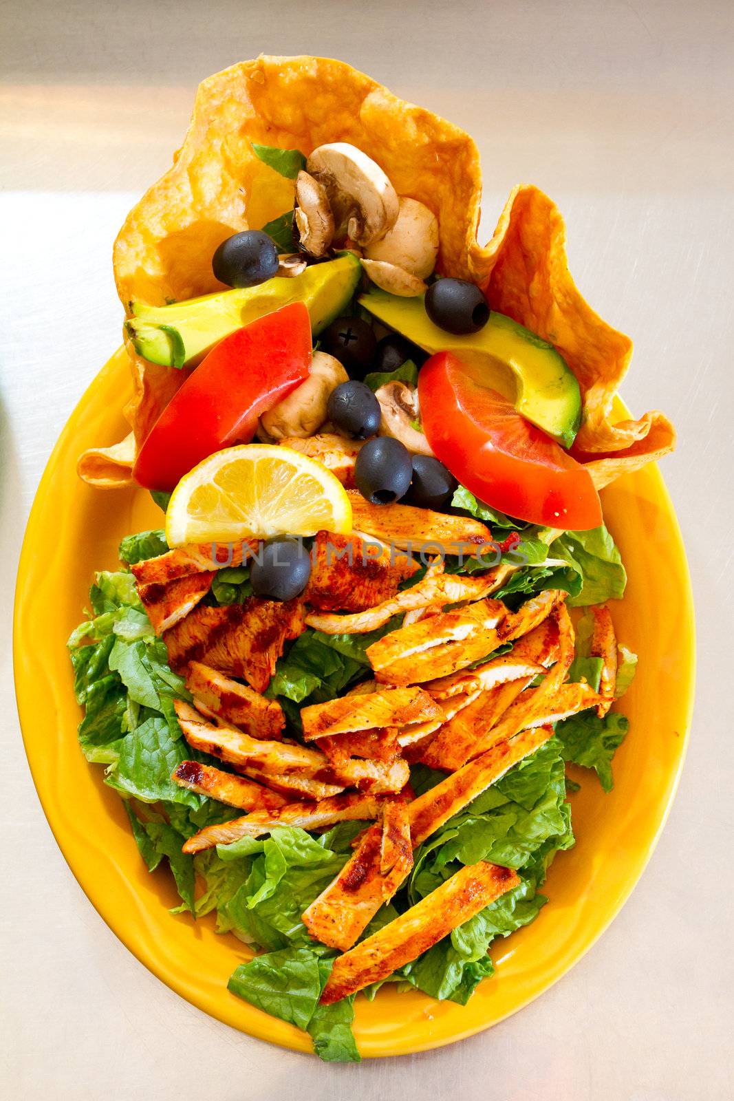 A salad at a Mexican restaurant ready to be served.