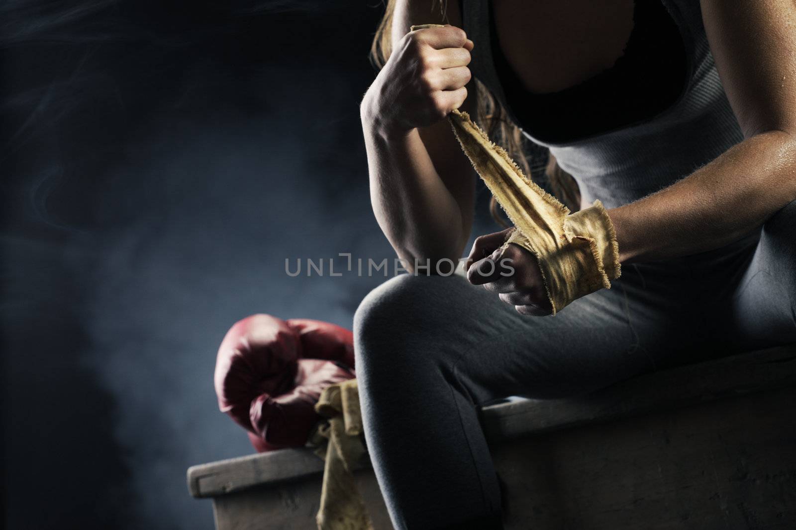 Woman boxer wearing white strap on wrist