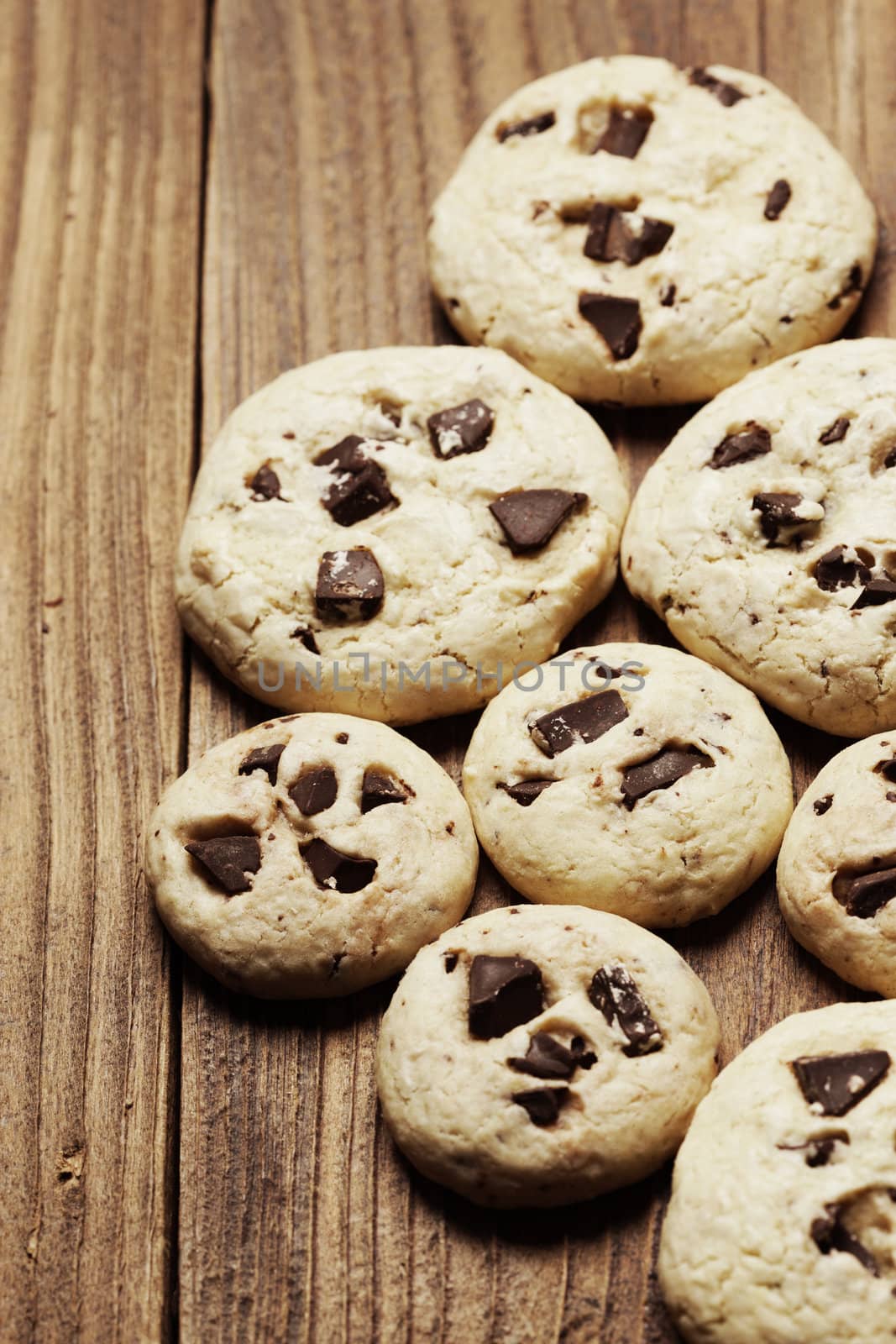 Group of chocolate chip cookies on wooden background