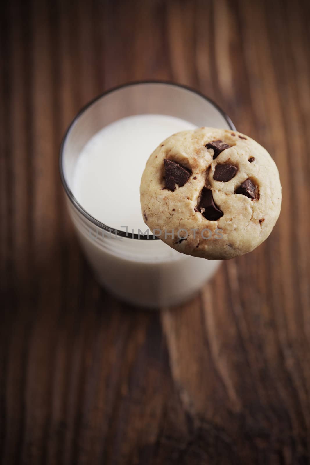 Chocolate chip cookies and glass of milk, copy space