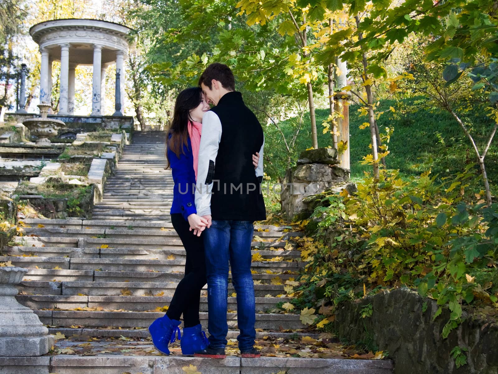 Loving couple in the autumn park abandoned