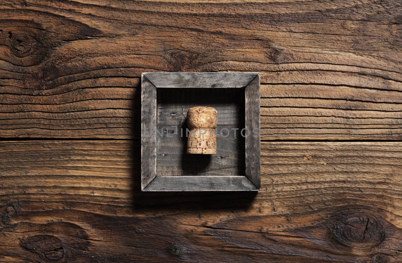 Cork on wooden background, copy space