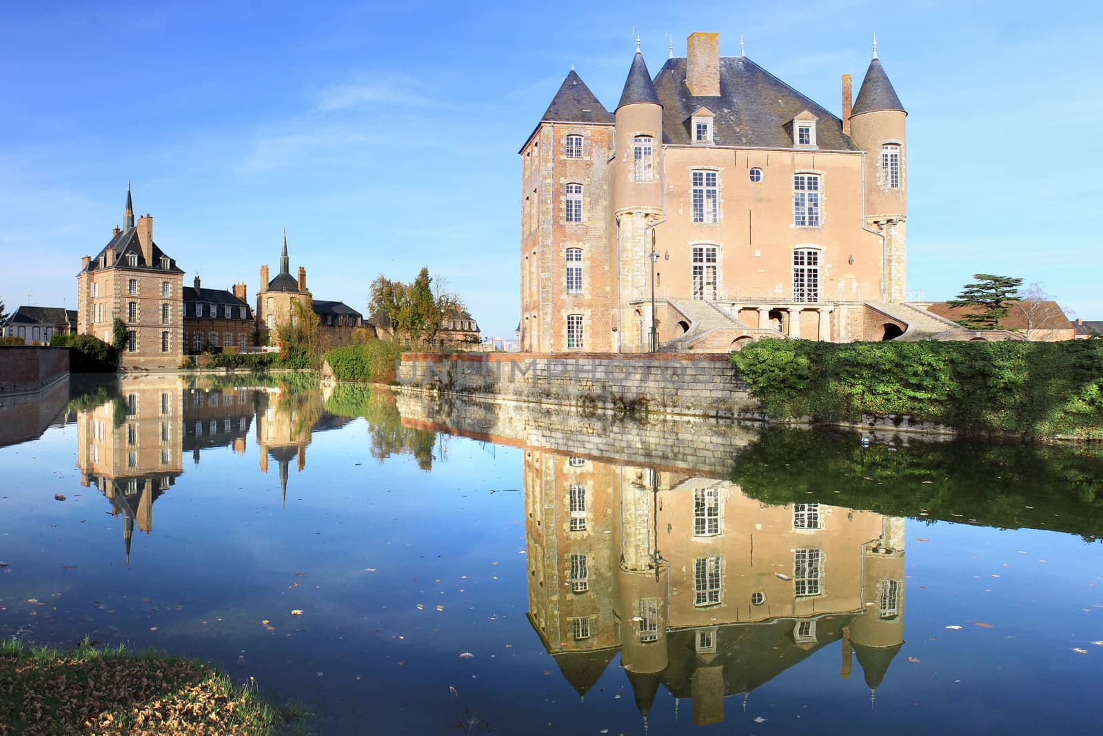 a castle with its moats, its park and garden with its towers and its ancient architecture