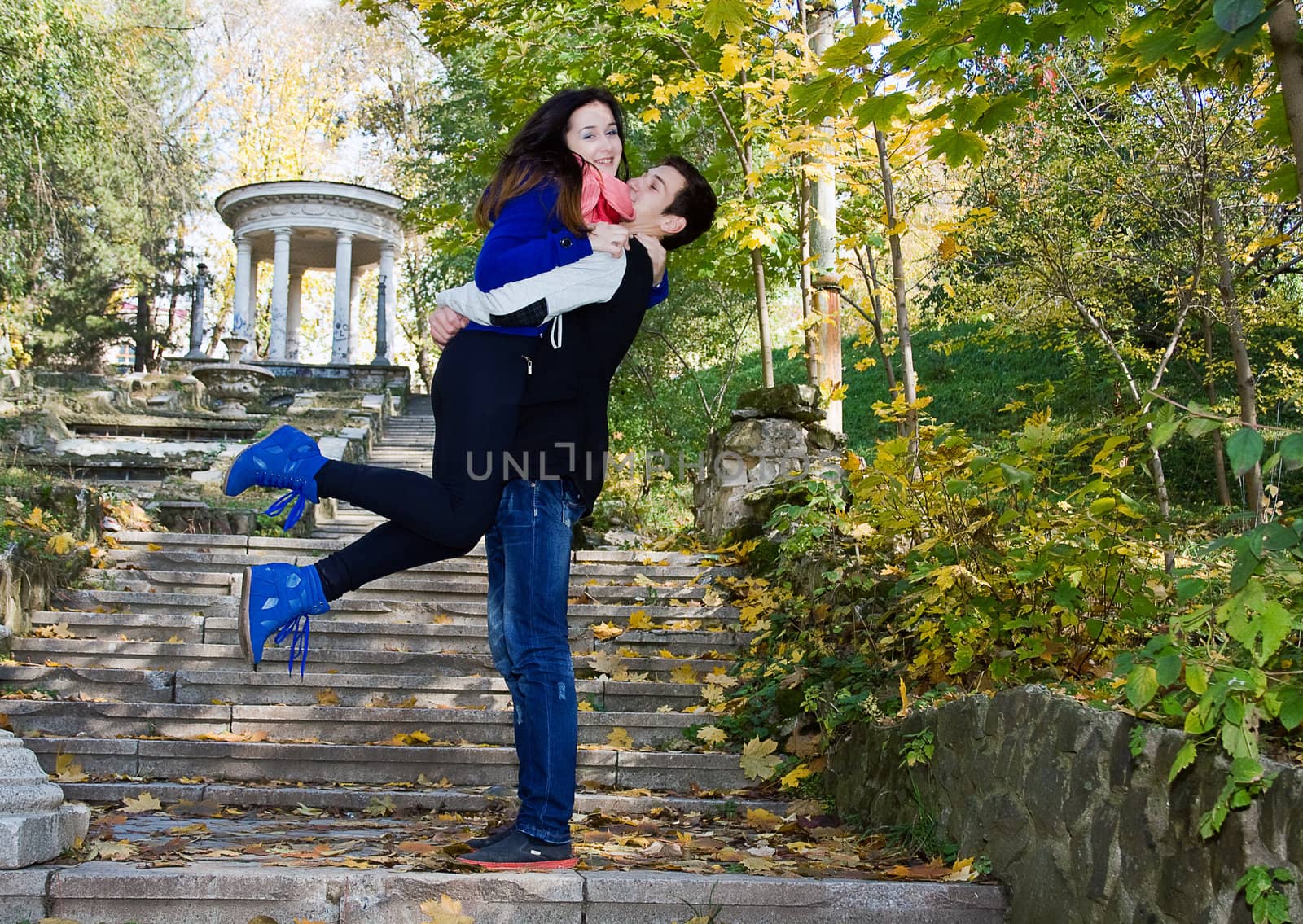 Happy smiling embracing couple being together in nature by Irina1977