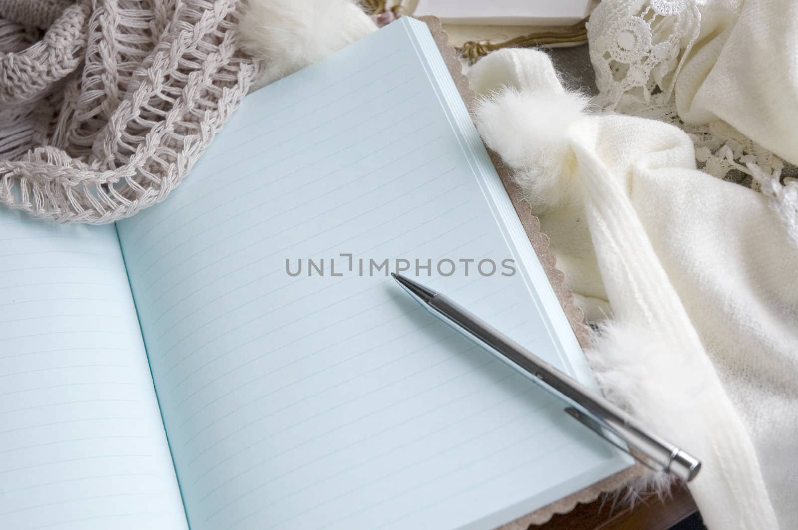 note book put on scarf by daniaphoto