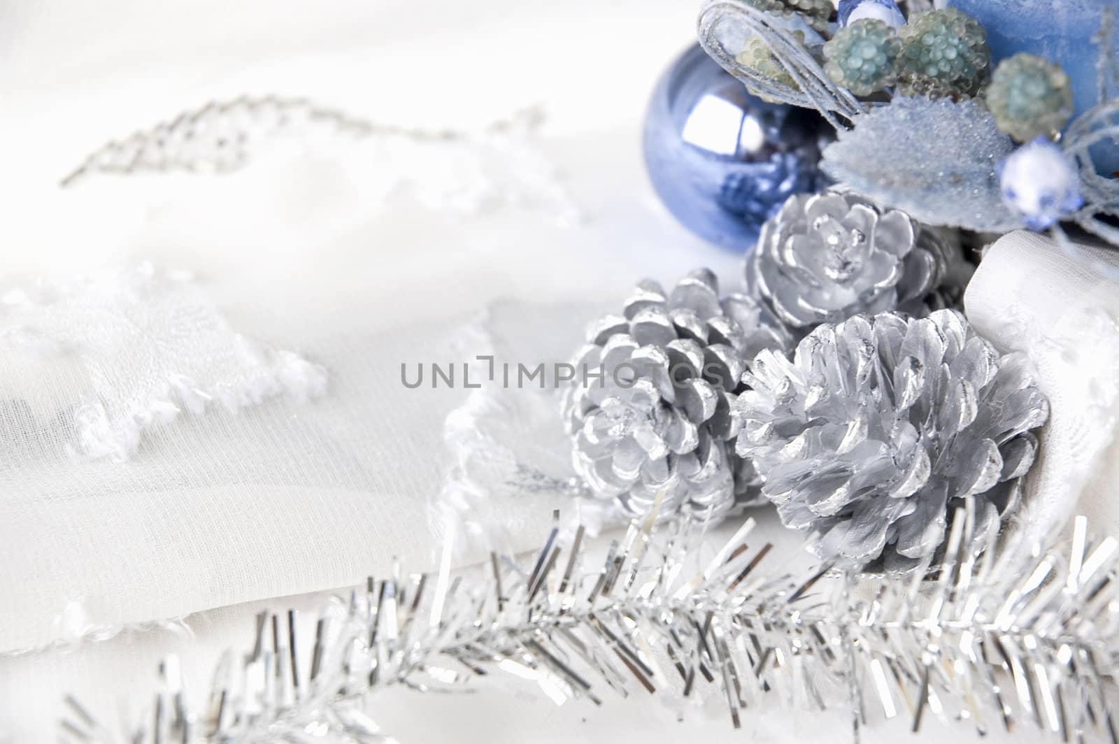 silver pine cones and blue ornament decorations