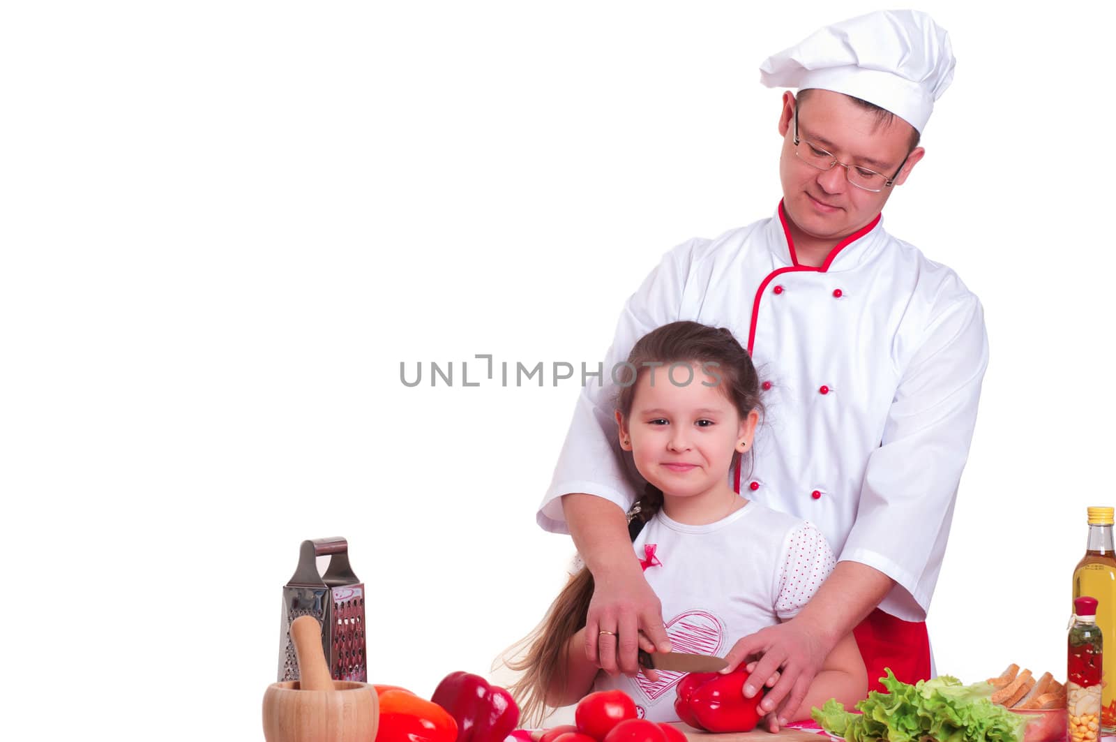 Father and daughter cooking a meal together