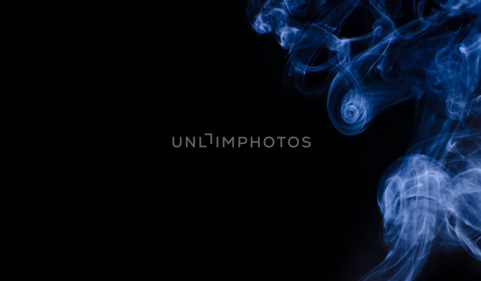 Blue smoke curls over black background by dmitrimaruta