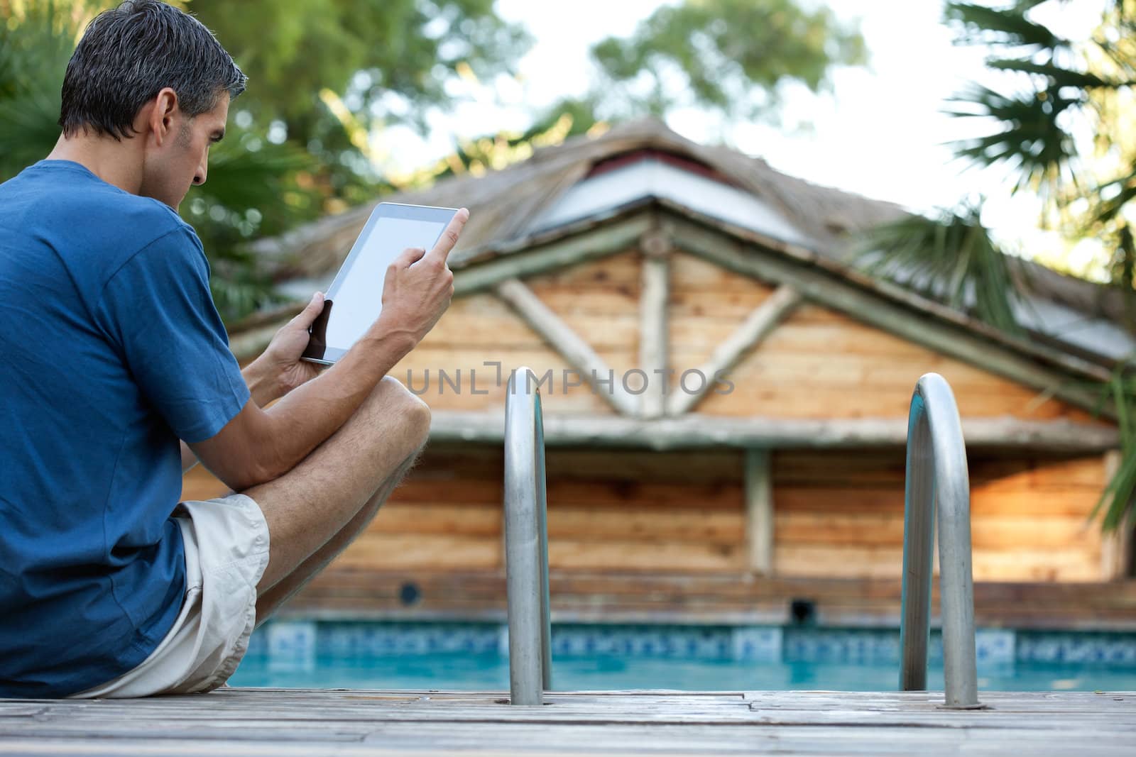 Casual Man Holding Tablet PC by leaf