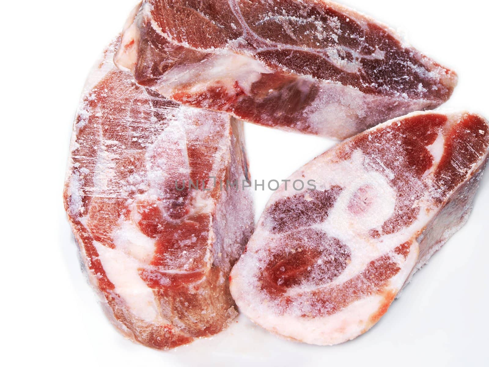 Raw meat, three pieces, isolated towards white background