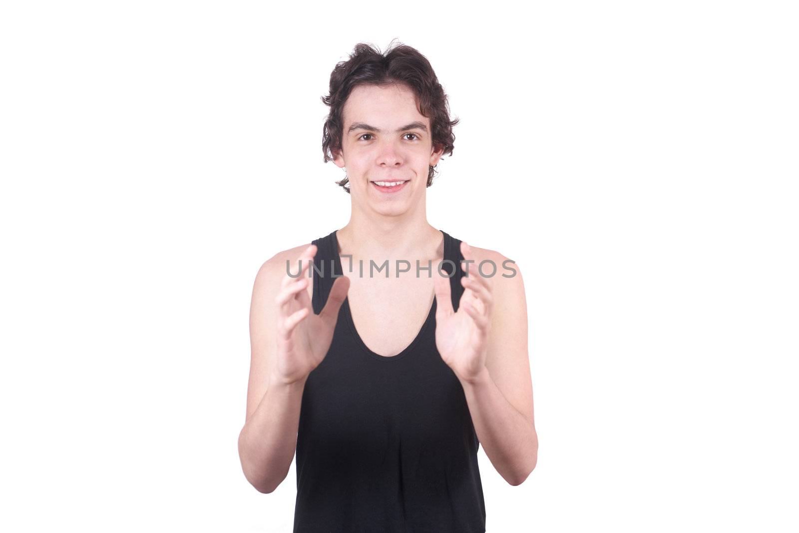 The boy holds something on a white background