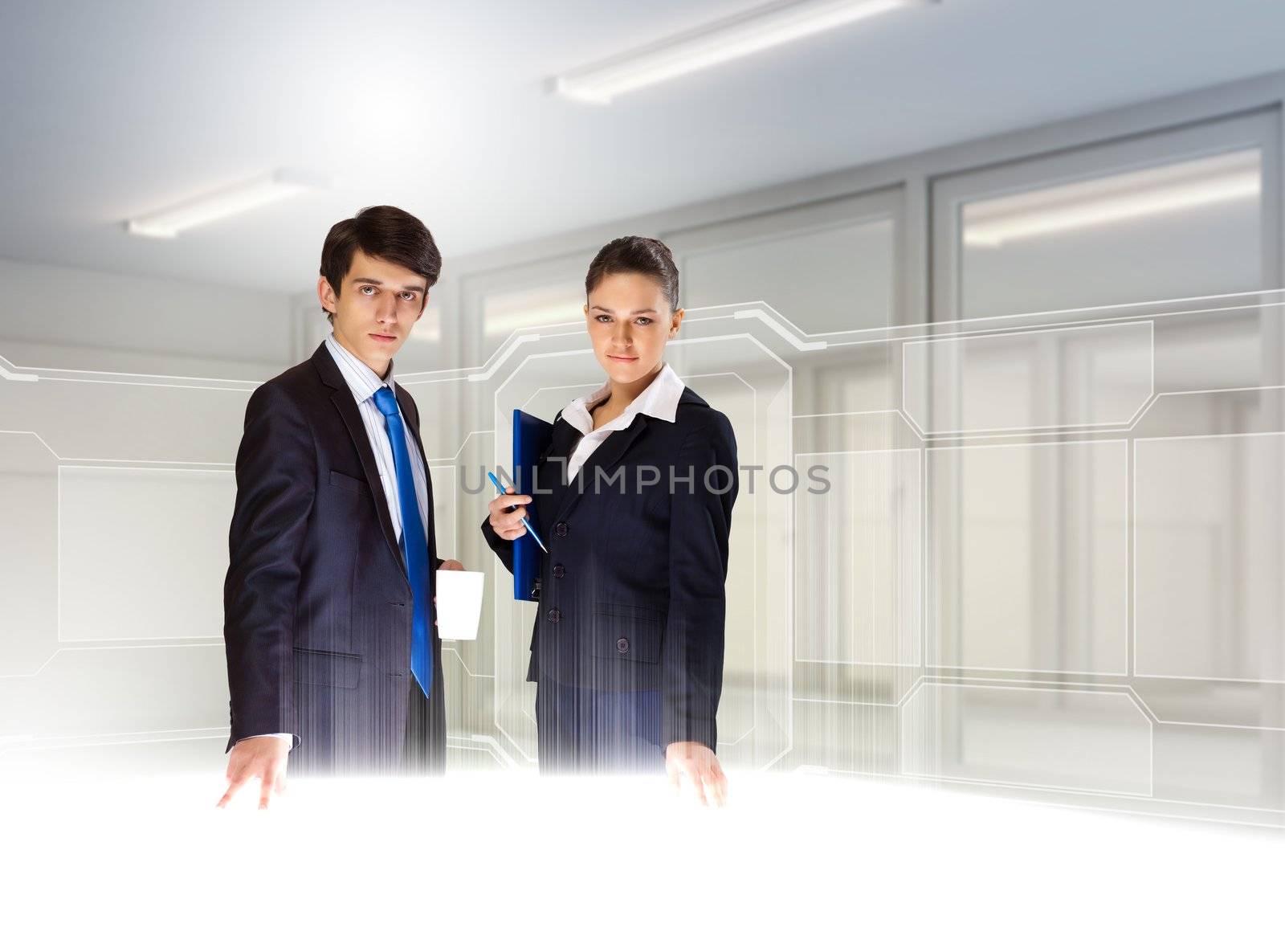 Young busuinesspeople standing against high-tech image background