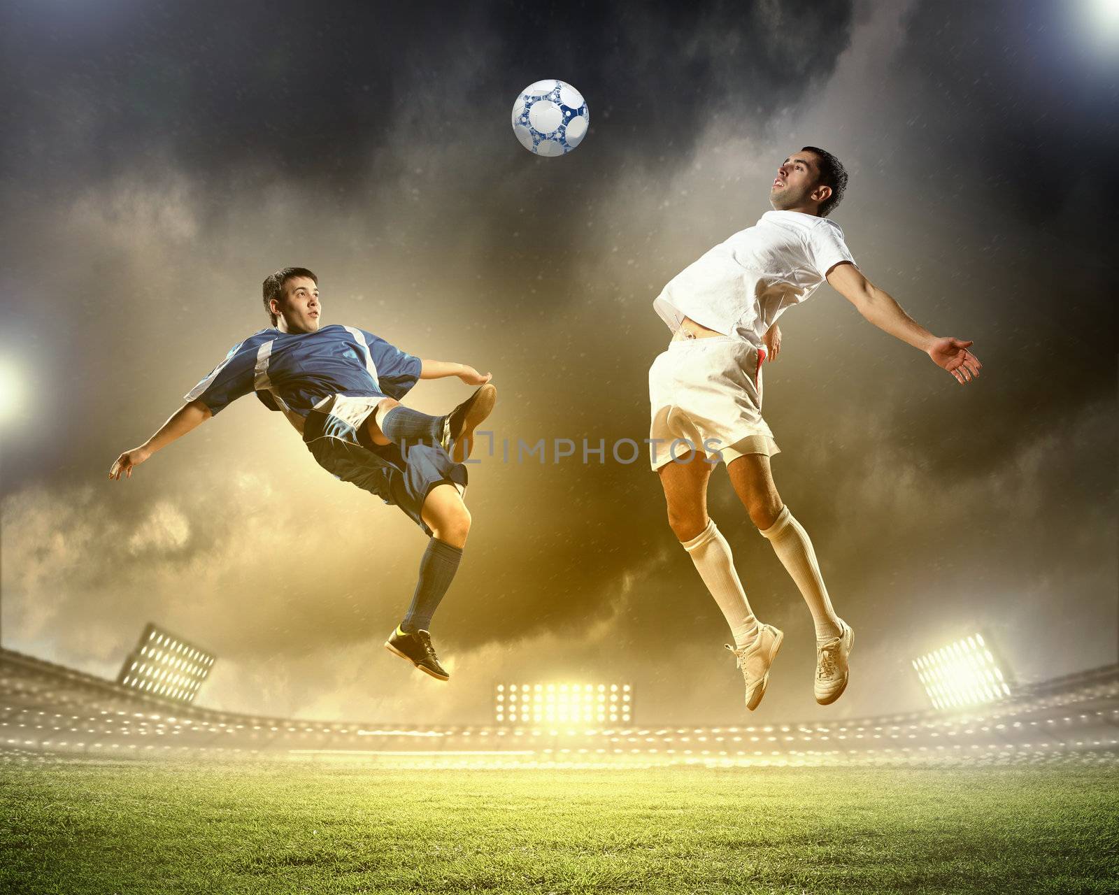 two football players striking the ball by sergey_nivens
