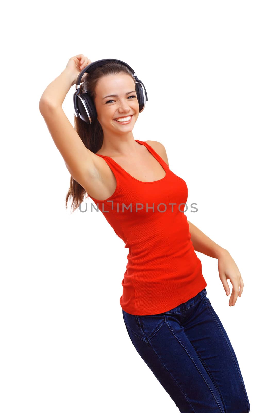 Happy smiling girl dancing and listening to music