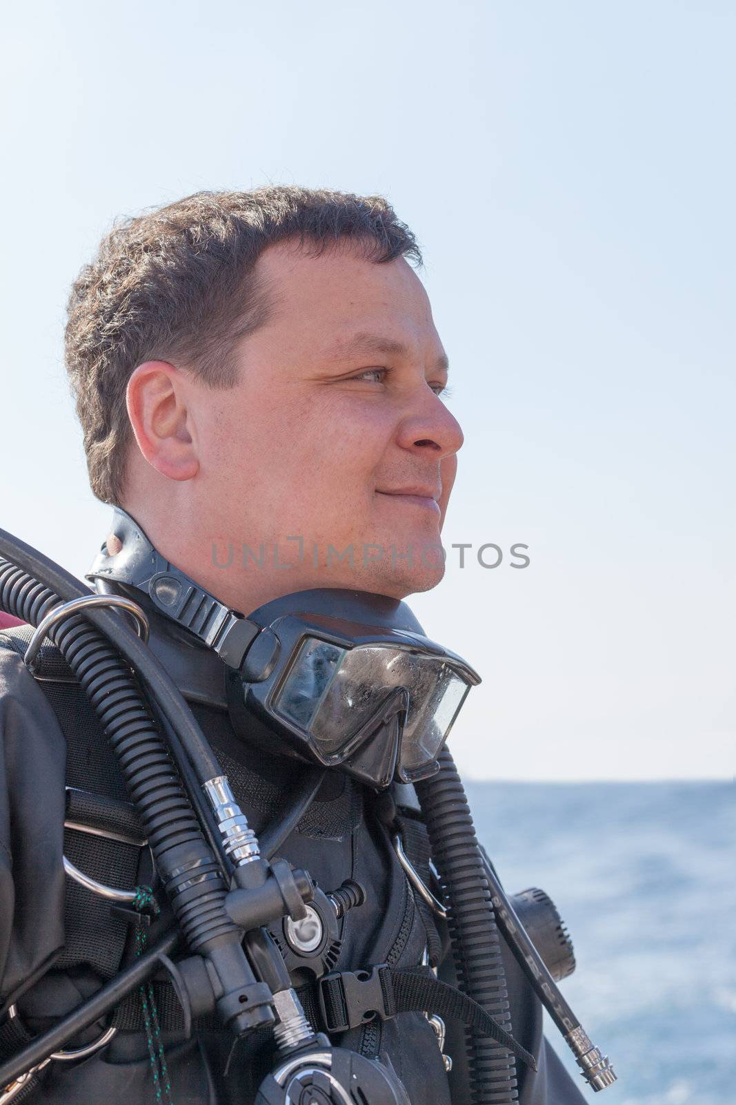 Portrait shot of a scuba diver from the side by Discovod