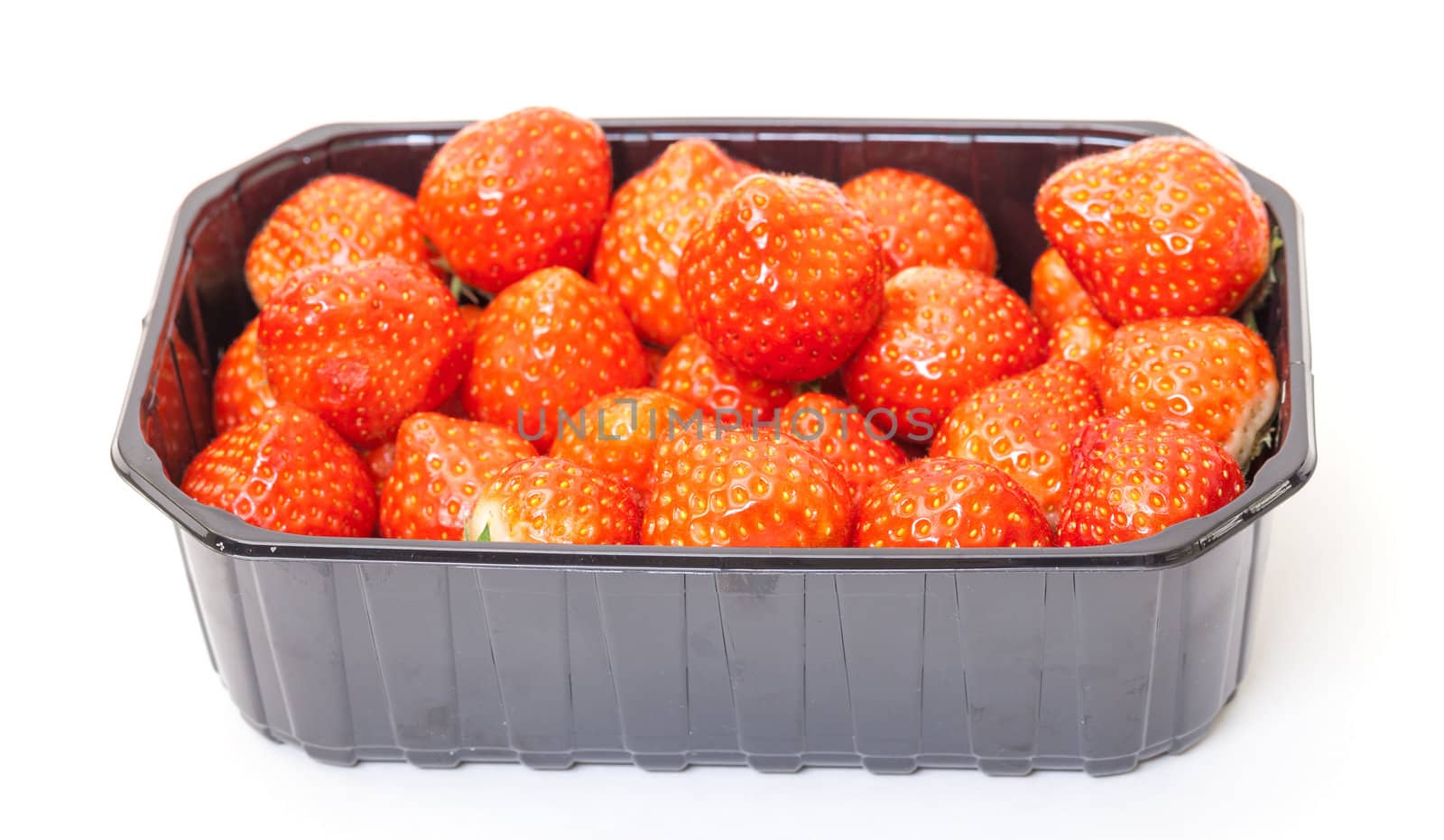 Fresh Strawberries in a Plastic Container on a white background.