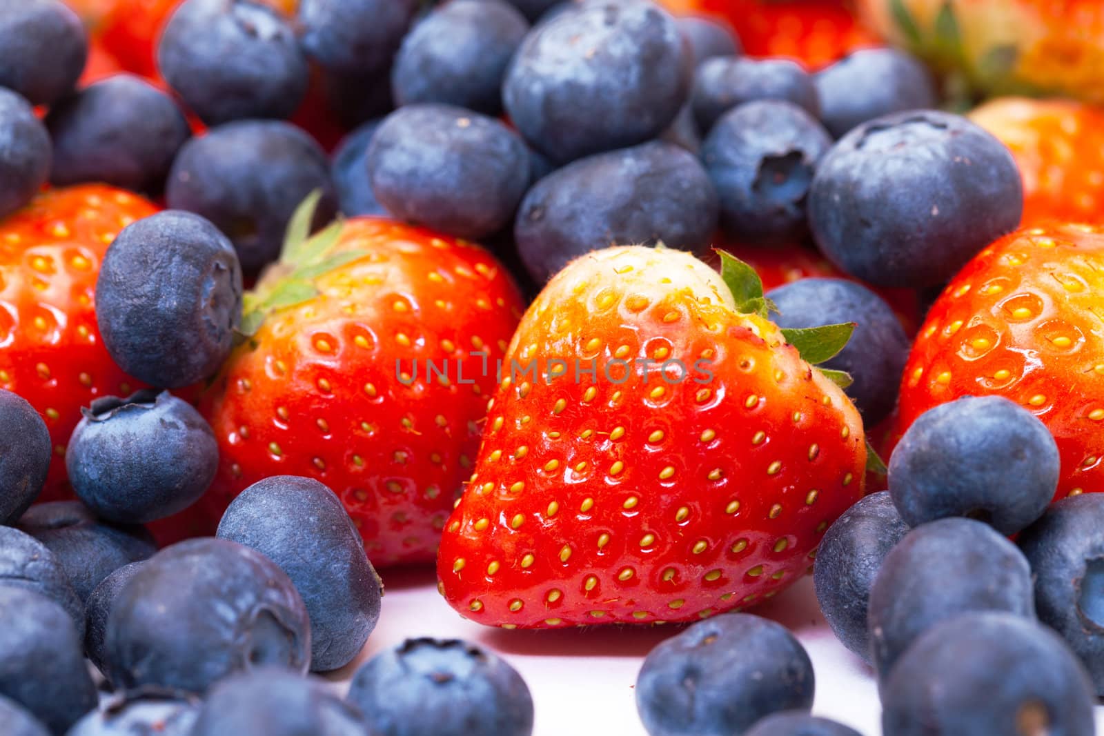 Heap Fresh Strawberries and Blueberries, closeup