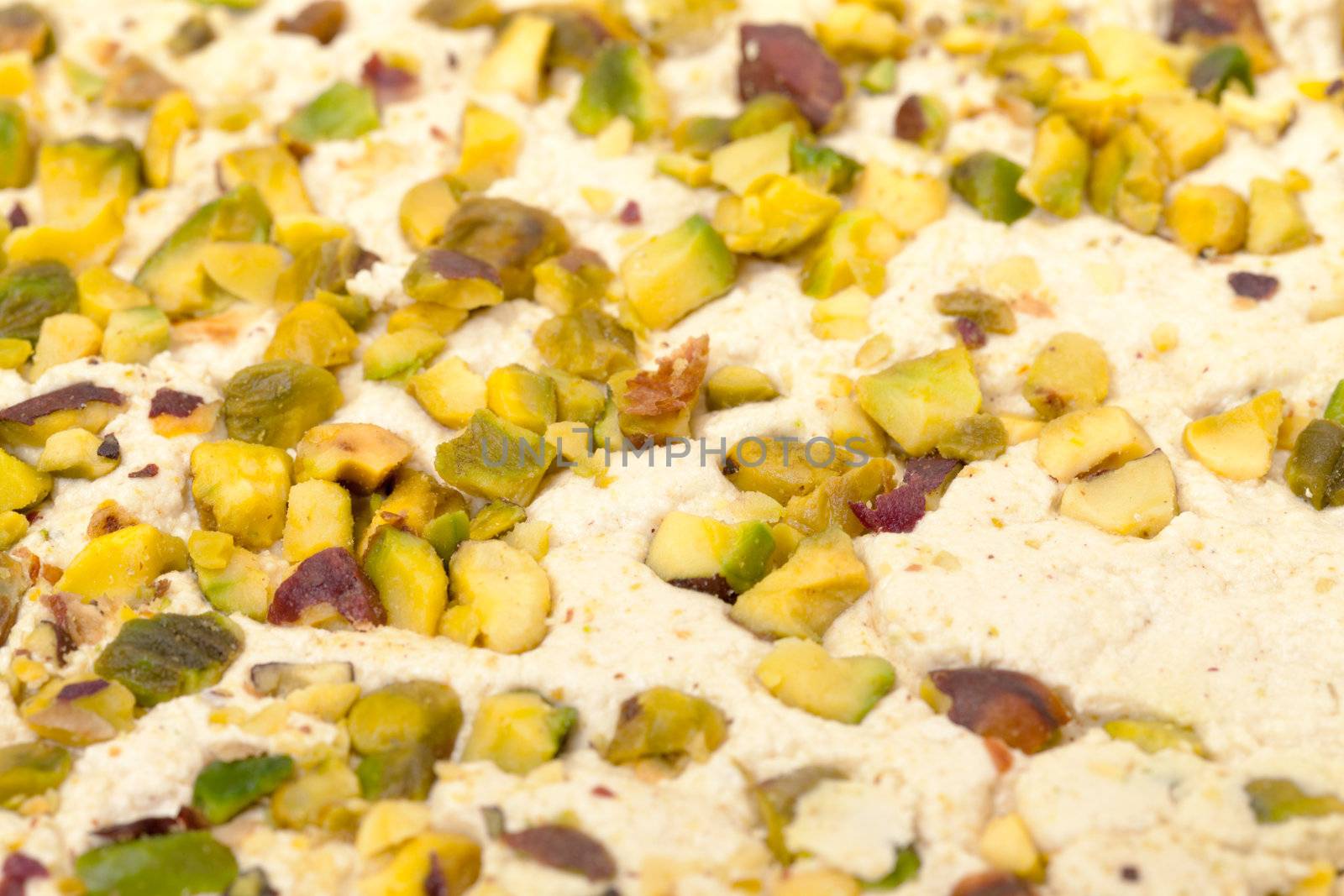 Halva with pistachios, background closeup