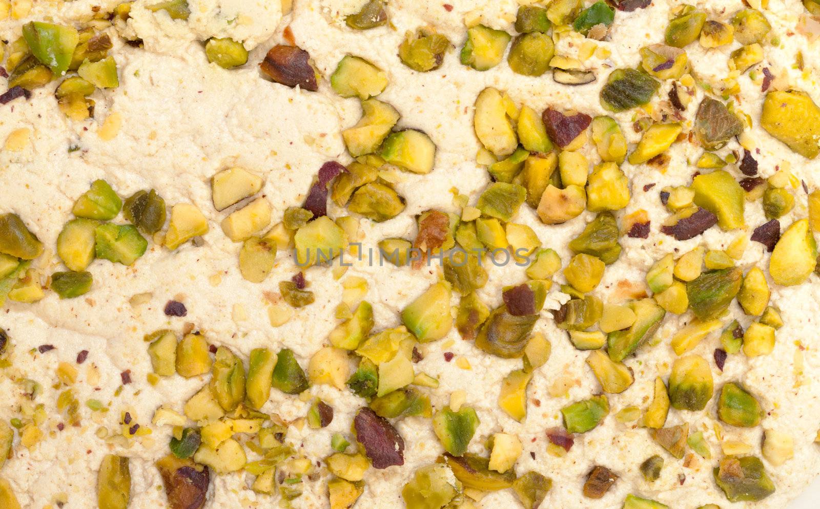 Halva with pistachios, background closeup