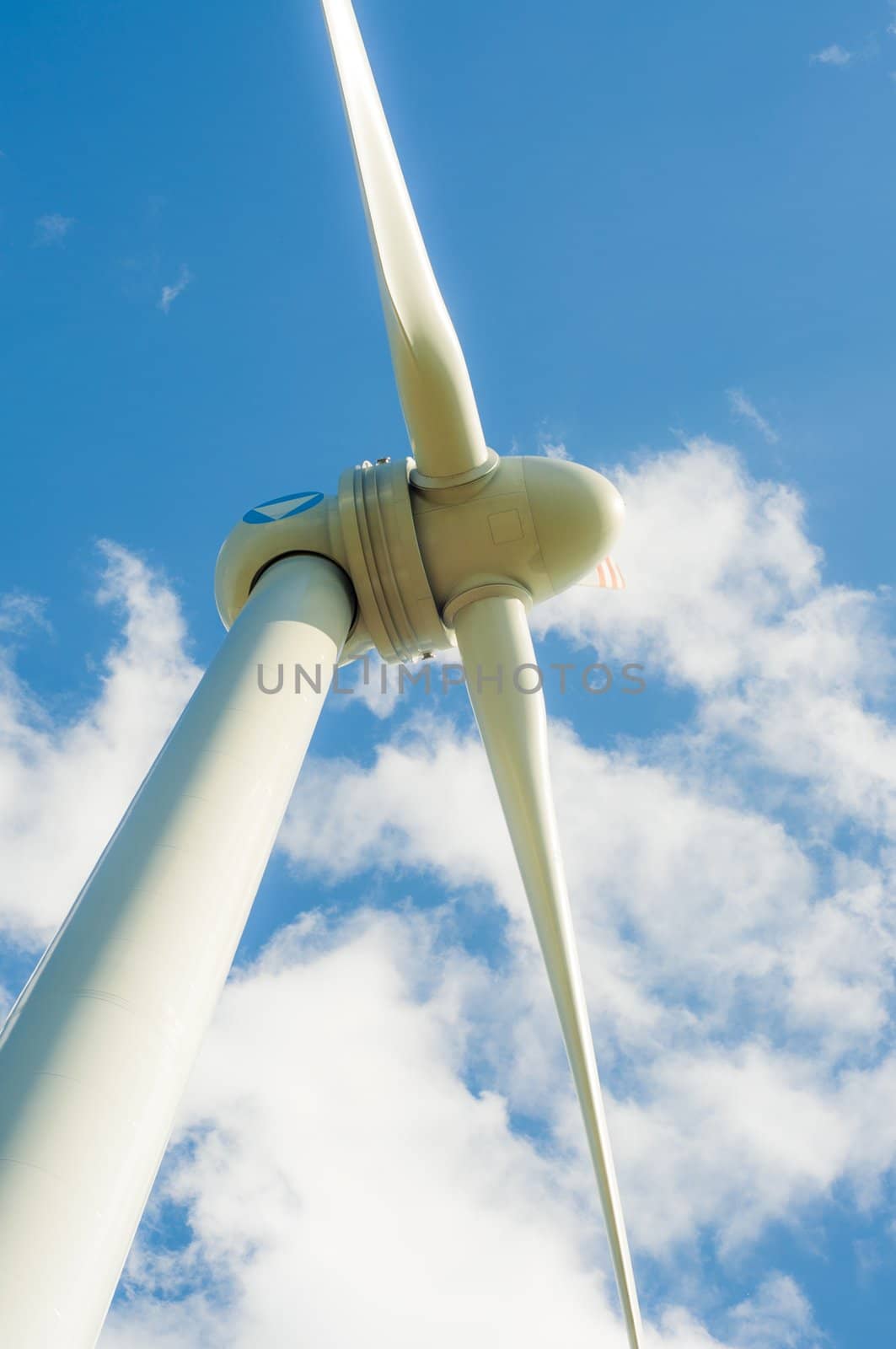 An image of windturbines against blue sky
