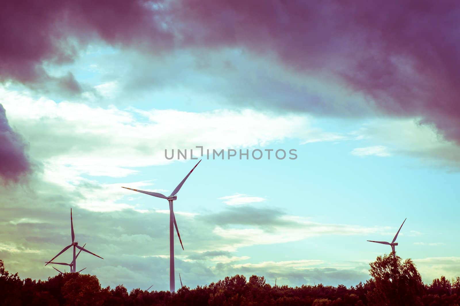 An image of windturbine during beautiful sunset