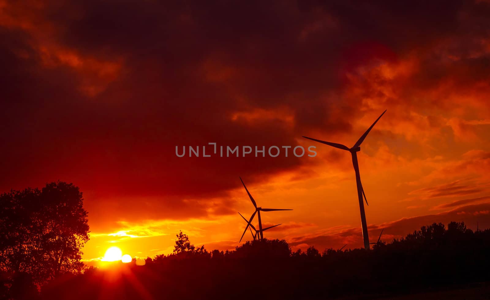 An image of windturbine during beautiful sunset