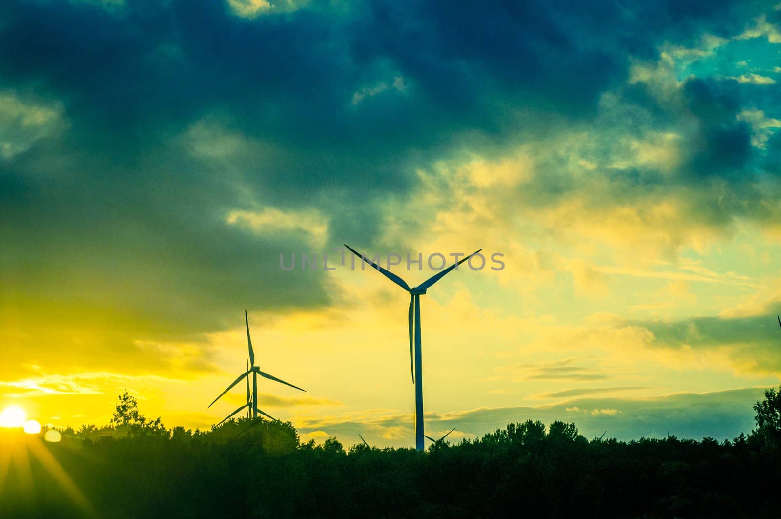 An image of windturbine during beautiful sunset