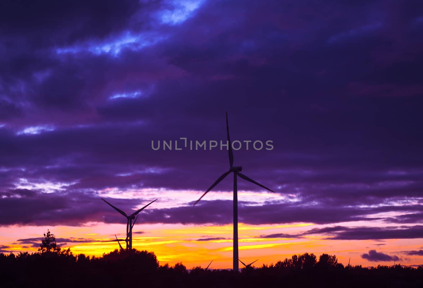 An image of windturbine during beautiful sunset