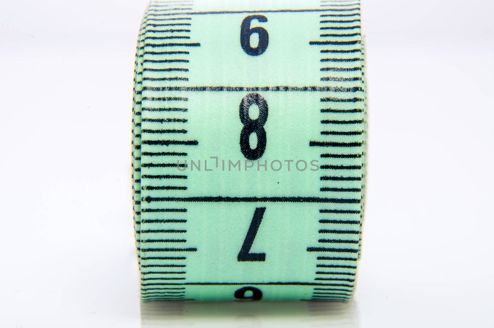 An image of green centimeter on white background
